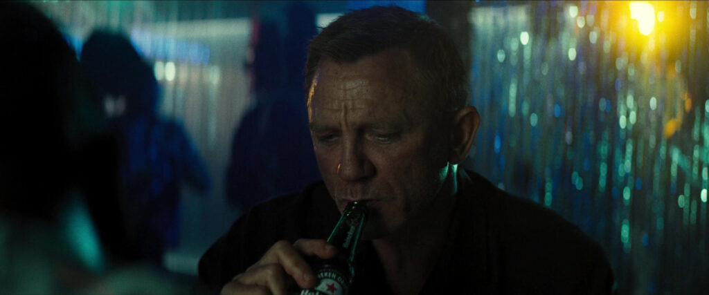 Daniel Craig As James Bond enjoying a Heineken Beer. This is an example of surprise product placement.